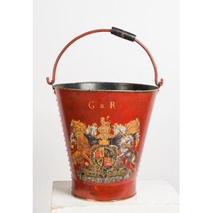 A large red painted tole ware coal bucket with central family…