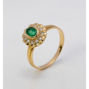 An emerald and diamond cluster ring, Oval cut emerald&hellip;