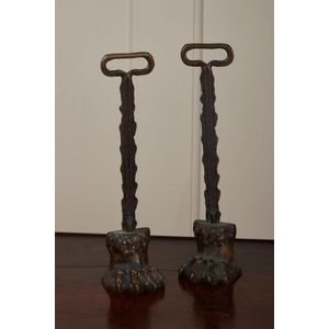 A pair of brass lions paw doorstops, English 19th century, 38…