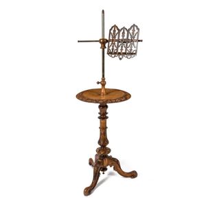 An antique English walnut music stand, 138 cm high