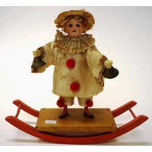 Antique Simon & Halbig porcelain doll on a rocker dressed in…