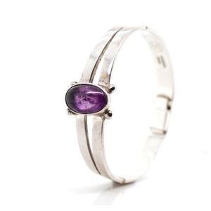 A good amethyst and silver hinged bangle by Talleres de los…