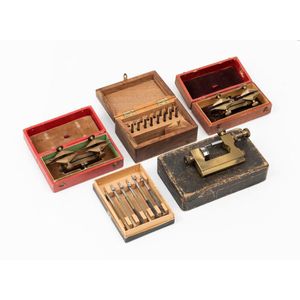 A collection of watchmaker's tools, including two small…