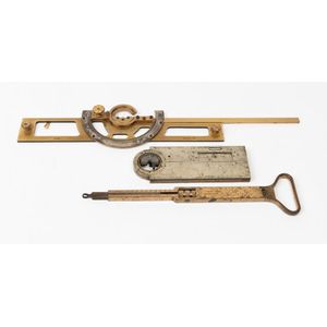 Three brass and metal surveyor's tools including a Mauch…
