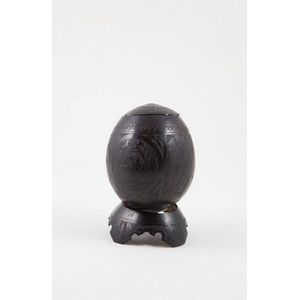 Early scrimshawed coconut with fine elaborate carving to…