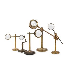 A group of five antique brass magnifiers, the largest 24 cm high