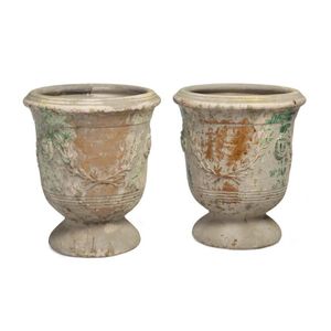A pair of mottled green pedestal urns, 57 cm high, 48 cm…