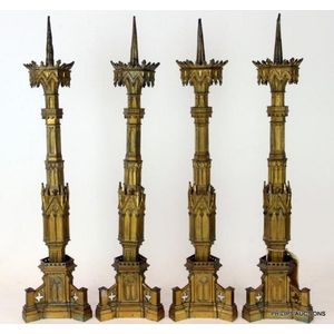 Lot - A PAIR OF ECCLESIASTICAL GOTHIC REVIVAL GILT BRASS PRICKET