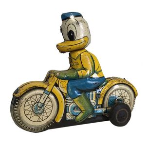 A Disney Donald duck on motorbike friction tin toy made by…