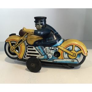 A wind-up motorcylist tin toy by Kuramochi, made in Japan,…