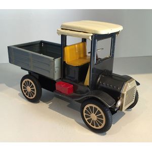 A collection of toy cars, including a Japanese tin toy pick-up…