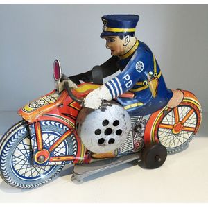 A wind-up police mechanical motorcycle tin toy with siren by…