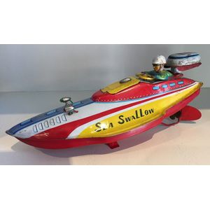 A sea Swallow Speed boat tin litho toy by Marusan toys and a…