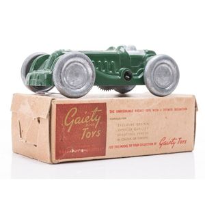 A Gaiety toy clockwork model racing car, racing green, driver…