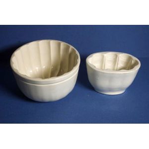 Two Copeland jelly moulds, one with interior fish design.…