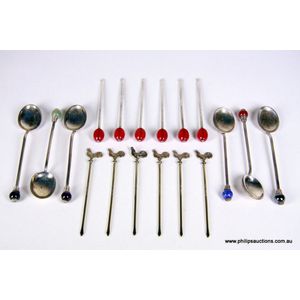 Two boxed sets of sterling silver novelty cocktail sticks, and…