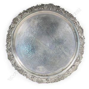 A late Victorian silver salver, rim embossed with shells and…