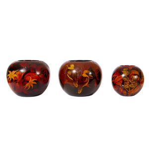 A group of spherical pokerwork vases, comprising an example…