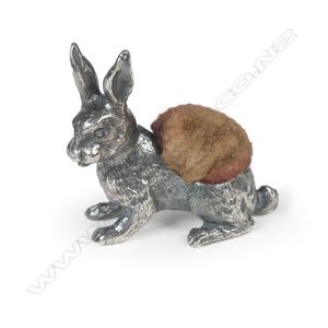 An Edwardian miniature silver pin cushion, in the form of a…