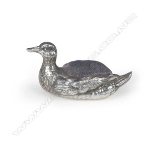 An Edwardian silver miniature pin cushion, in the form of a…