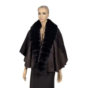 A cashmere cape, the self-belted grey cape with black fur trim…