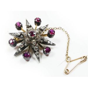 Antique and designer diamond and ruby brooches - price guide and