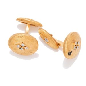 A pair of 18ct gold diamond cufflinks, each an oval brushed ...