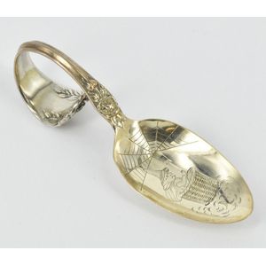 An American sterling silver baby spoon, featuring a witch, pat.…