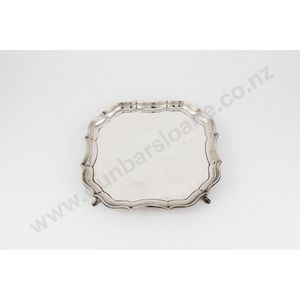 An Edward VIII sterling silver salver, shaped square with…