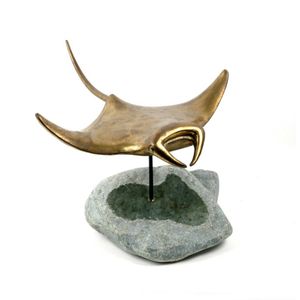 A brass and serpentine manta ray sculpture, with wings…
