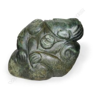 A large Maori figure carved pounamu boulder, the stylised…