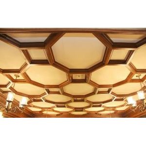 A late Victorian walnut panelled ceiling in hexagonal pattern,…