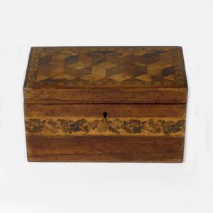 A parquetry and Tunbridge inlay tea caddy, opening to reveal…
