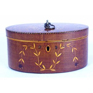 George III oval mahogany tea caddy with leaf inlays and chequer…