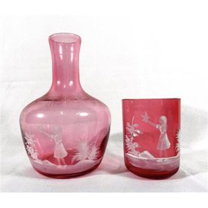A Mary Gregory cranberry decanter & matching beaker glass, late…