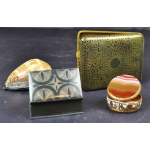 A cigarette case and three boxes (i) an Oriental cigarette case…