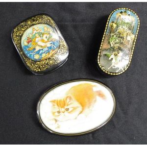Three decorated Russian lacquer trinket boxes including 2 boxes…