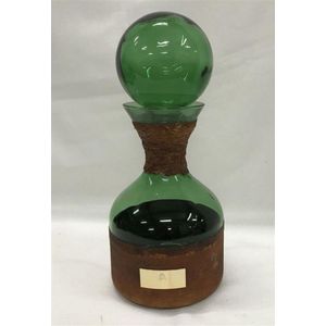 A green glass & leather decanter with ball top, presentation…