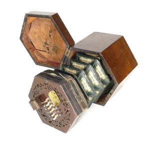 An antique concertina, a small hexagonal concertina in original…