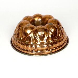 A copper food mould, domed, eight-petal pattern. Diameter 26 cm