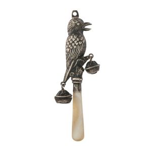 A baby's rattle in the form of a kookaburra with gumnut bells,…