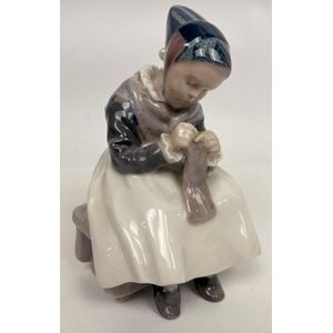 A Royal Copenhagen figure of a young women sewing, #1314,&hellip;