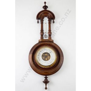 Small Victorian walnut cased aneroid barometer with urn finials…