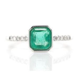 Emerald and diamond set 18ct white gold ring marked 750, one…