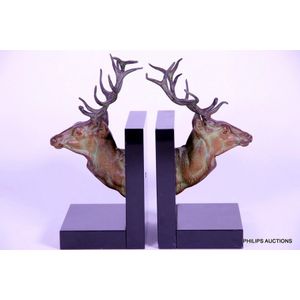 A pair of spelter stag bookends, circa 1930, modelled as a pair…