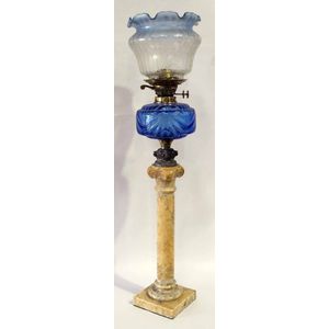 A Victorian banquet lamp, blue glass reservoir on carved marble…
