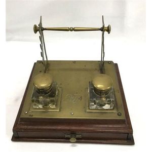 A brass desk set with two ink bottles & quill holder