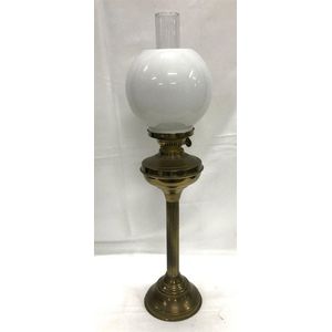 A tall brass oil lamp, height 70 cm