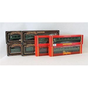 Eight various train carriages, four Mainline and four Hornby…