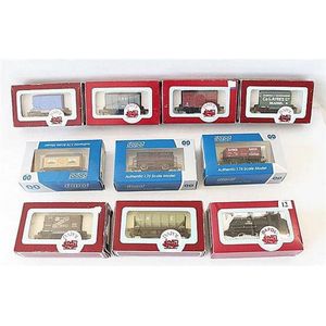 Nine various Dapol freight carriages, and one Dapol locomotive…